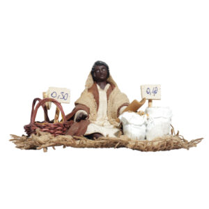 Mora Seduta a Terra Con Semi