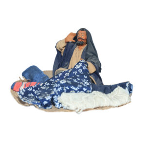 Mercante Stoffe Seduto a Terra