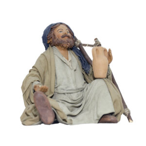 Elemosinante seduto per terra